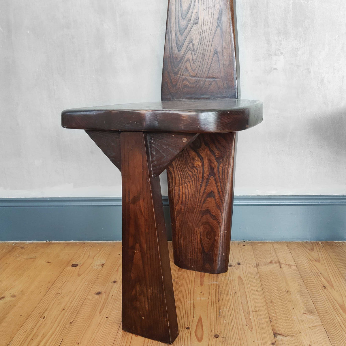 A pair of brutalist sculptural obelisk high back elm chairs