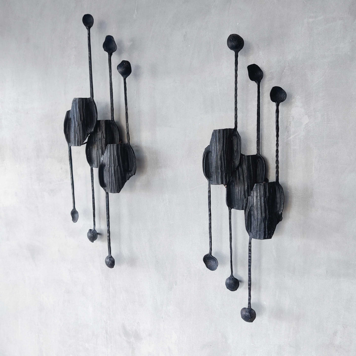 A pair of vintage Italian Brutalist sculptural wrought iron wall lights sconces