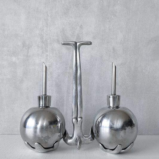Vintage 00s Carrol Boyes cast aluminium and stainless steel 'Hand it Over' figural oil and vinegar drizzler