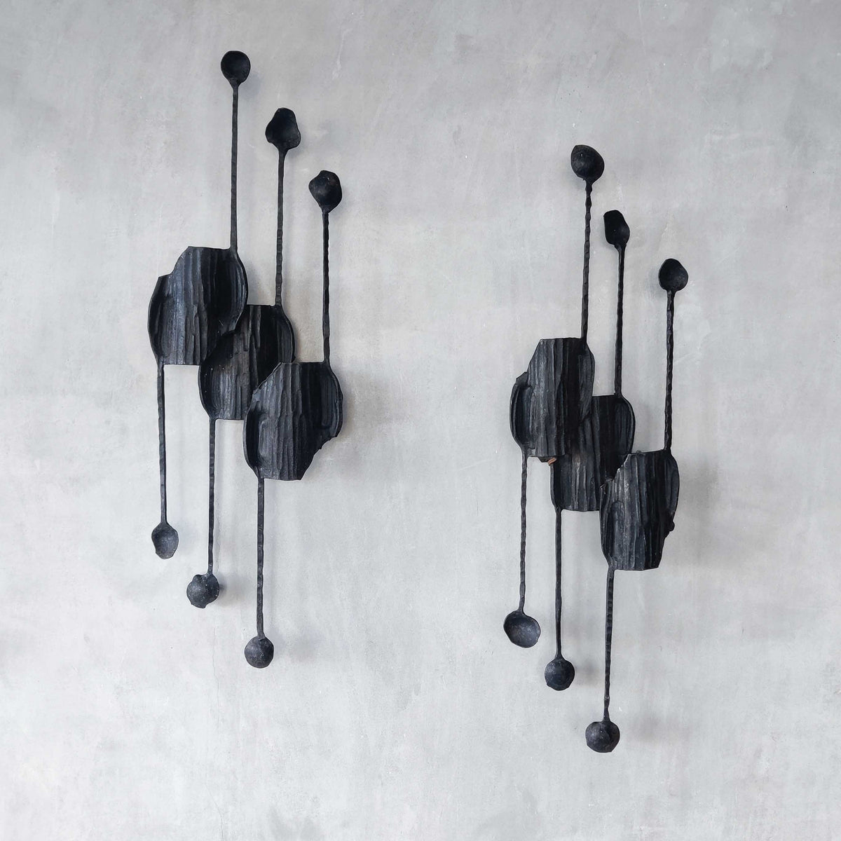 A pair of vintage Italian Brutalist sculptural wrought iron wall lights sconces