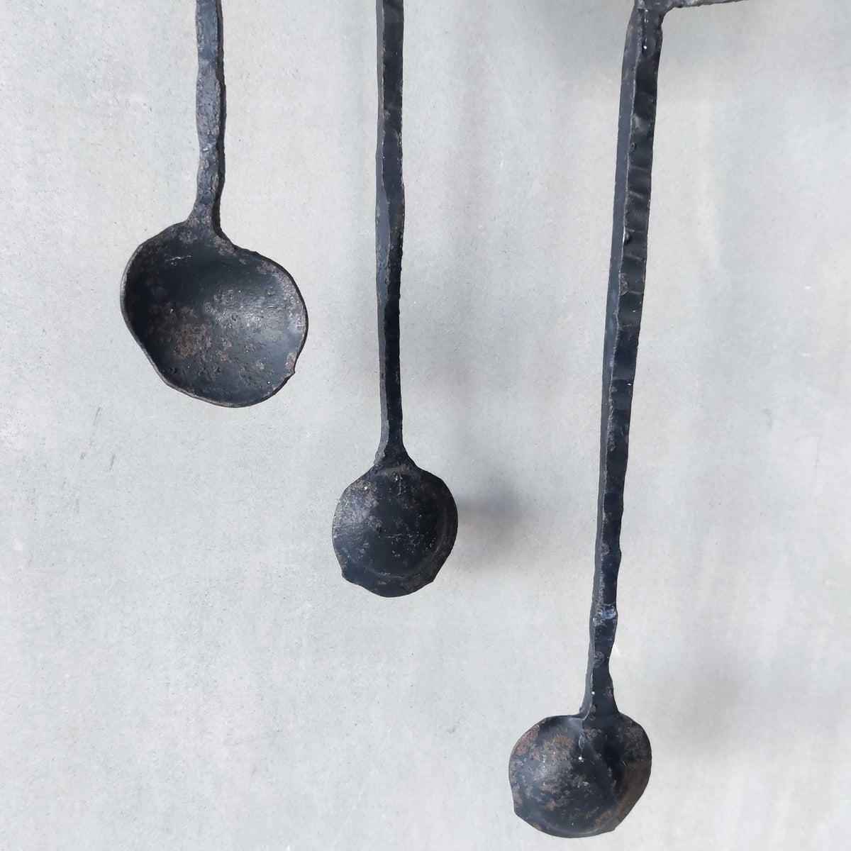 A pair of vintage Italian Brutalist sculptural wrought iron wall lights sconces