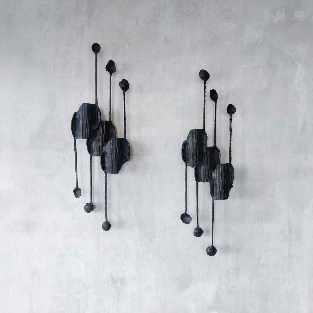 A pair of vintage Italian Brutalist sculptural wrought iron wall lights sconces