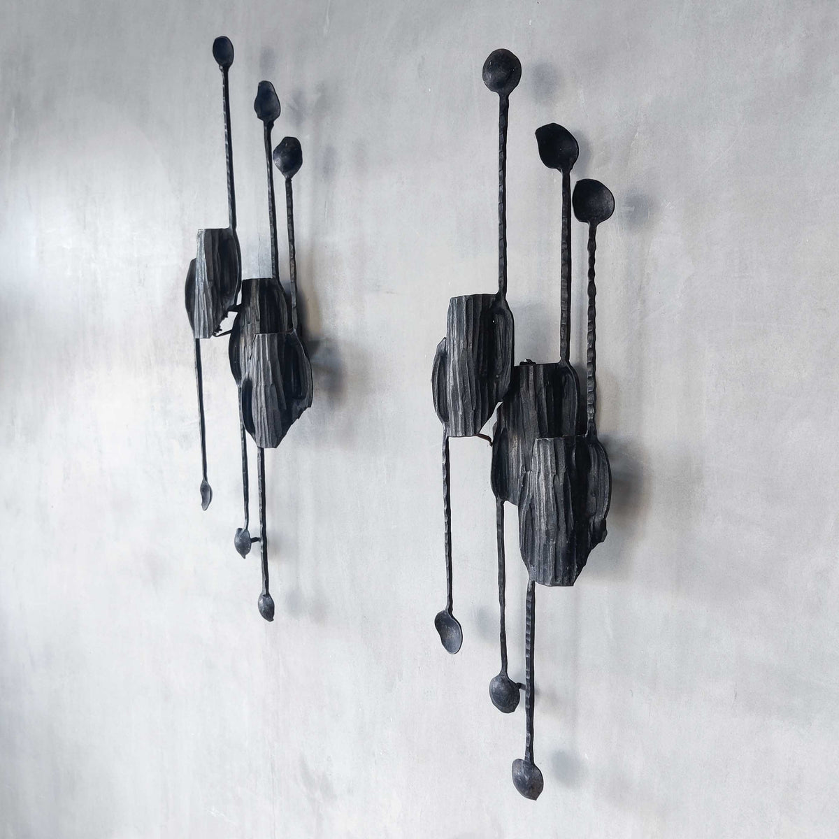 A pair of vintage Italian Brutalist sculptural wrought iron wall lights sconces
