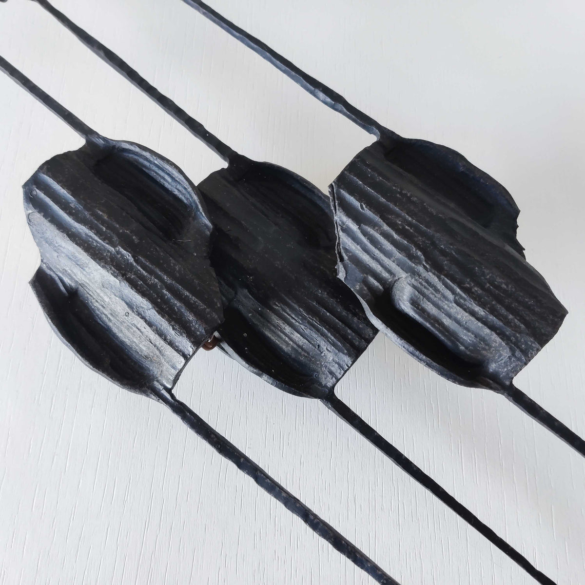 A pair of vintage Italian Brutalist sculptural wrought iron wall lights sconces