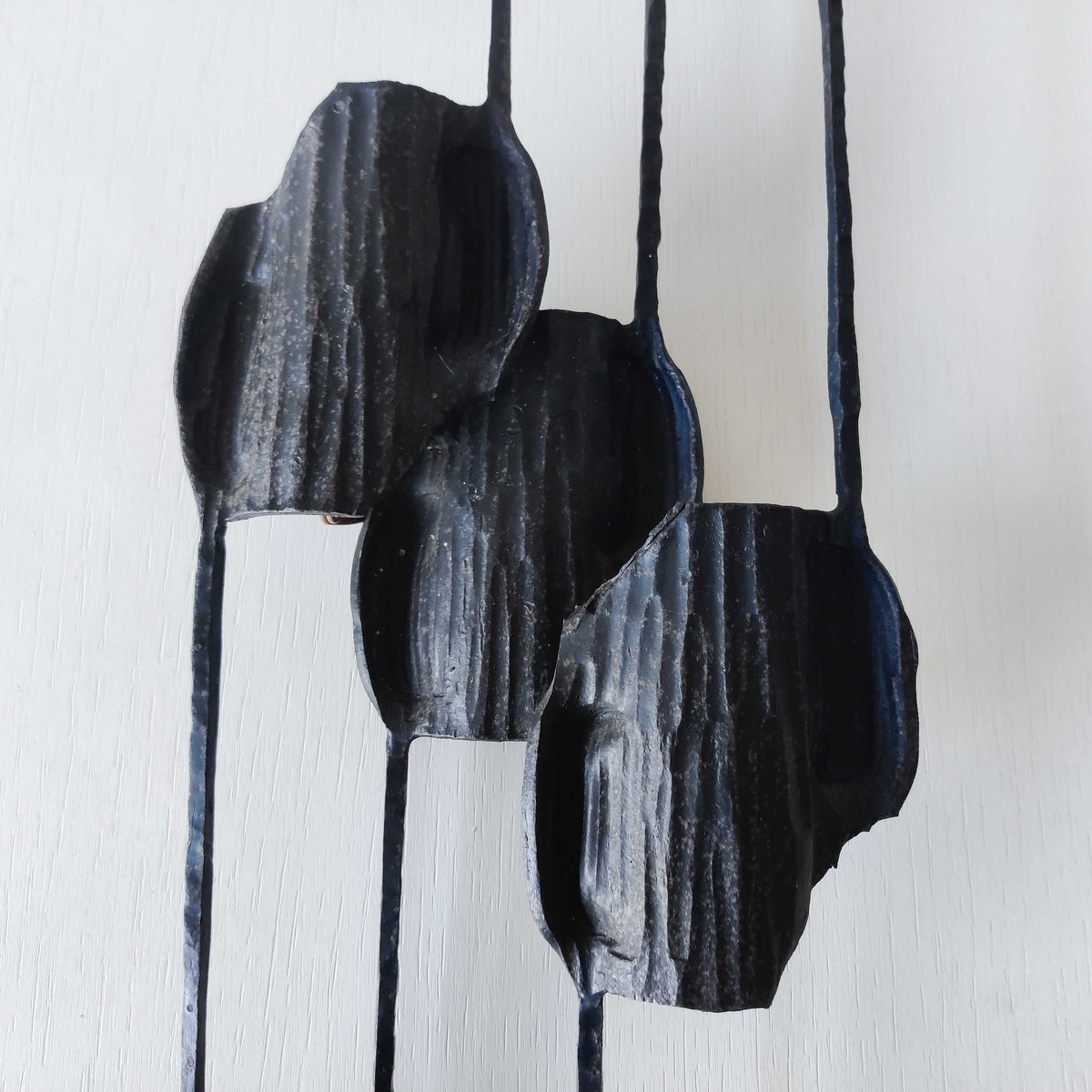 A pair of vintage Italian Brutalist sculptural wrought iron wall lights sconces