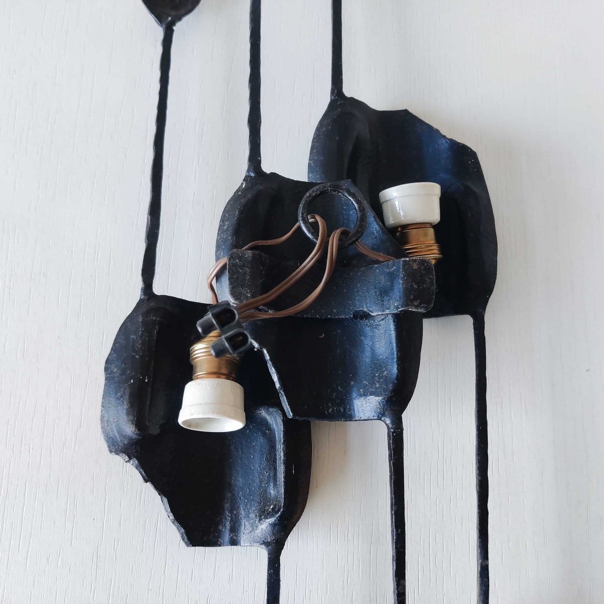 A pair of vintage Italian Brutalist sculptural wrought iron wall lights sconces