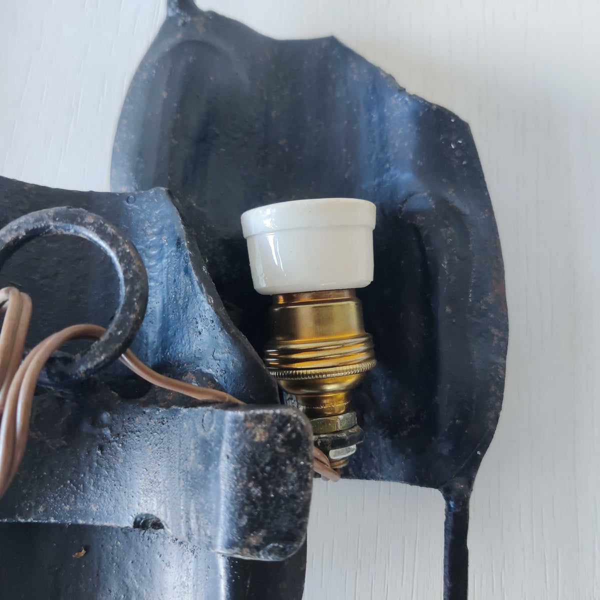 A pair of vintage Italian Brutalist sculptural wrought iron wall lights sconces