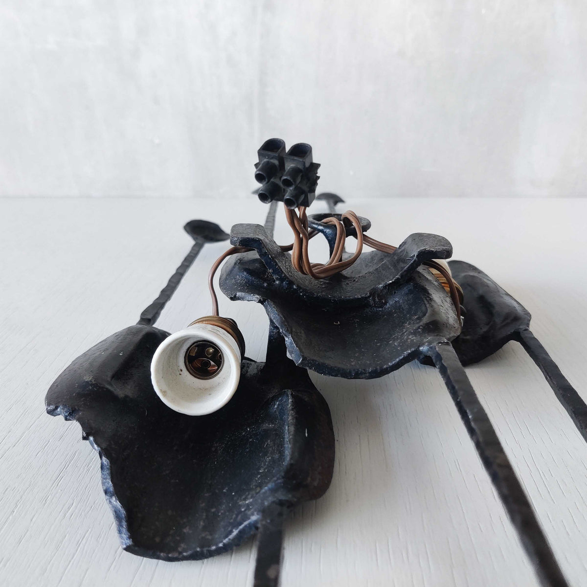 A pair of vintage Italian Brutalist sculptural wrought iron wall lights sconces