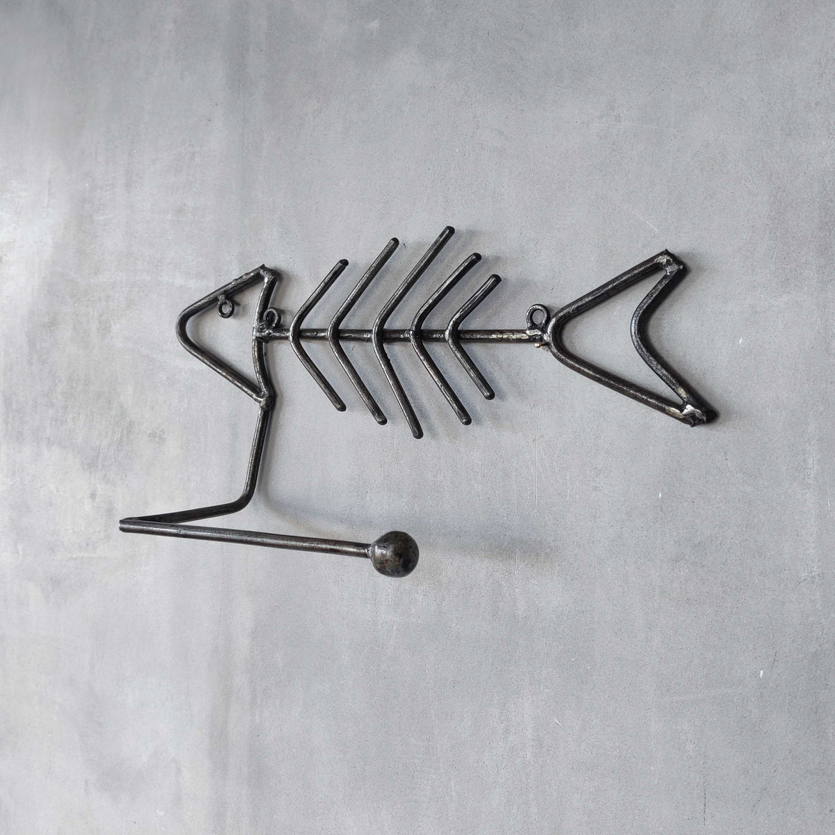 Vintage artisan made metalwork welded steel fish skeleton toilet roll holder