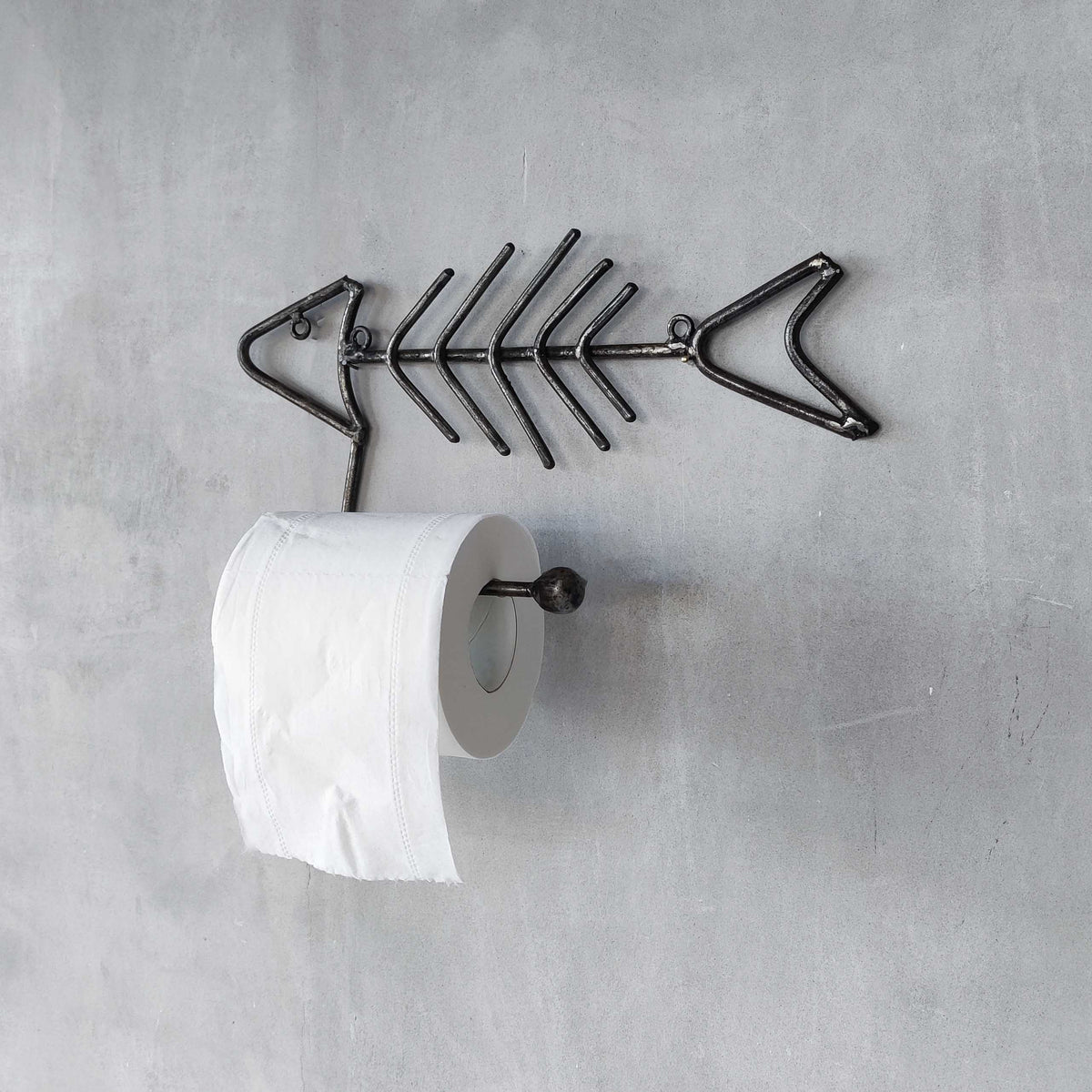 Vintage artisan made metalwork welded steel fish skeleton toilet roll holder