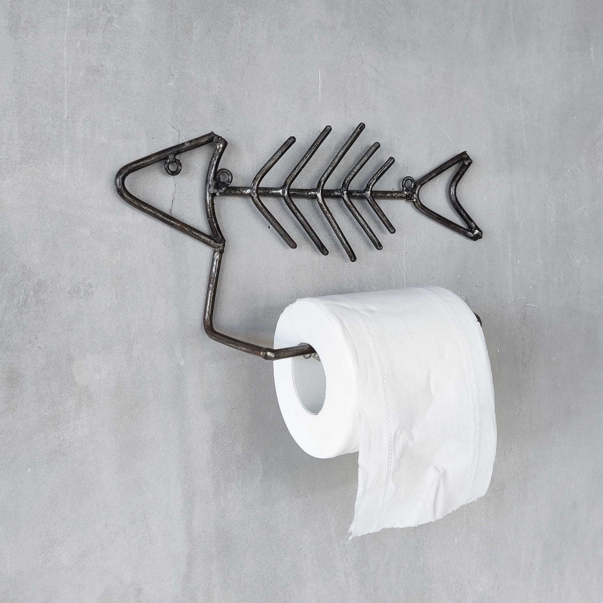 Vintage artisan made metalwork welded steel fish skeleton toilet roll holder