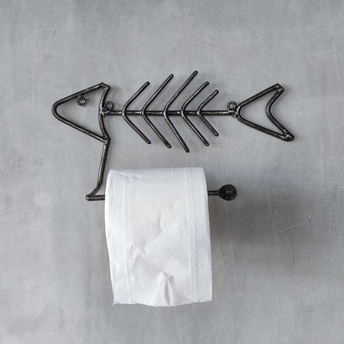 Vintage artisan made metalwork welded steel fish skeleton toilet roll holder