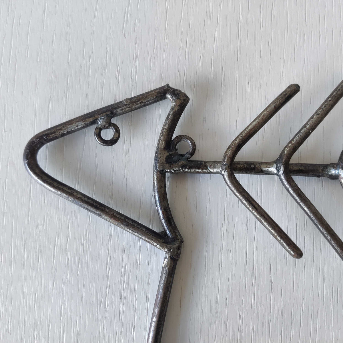 Vintage artisan made metalwork welded steel fish skeleton toilet roll holder