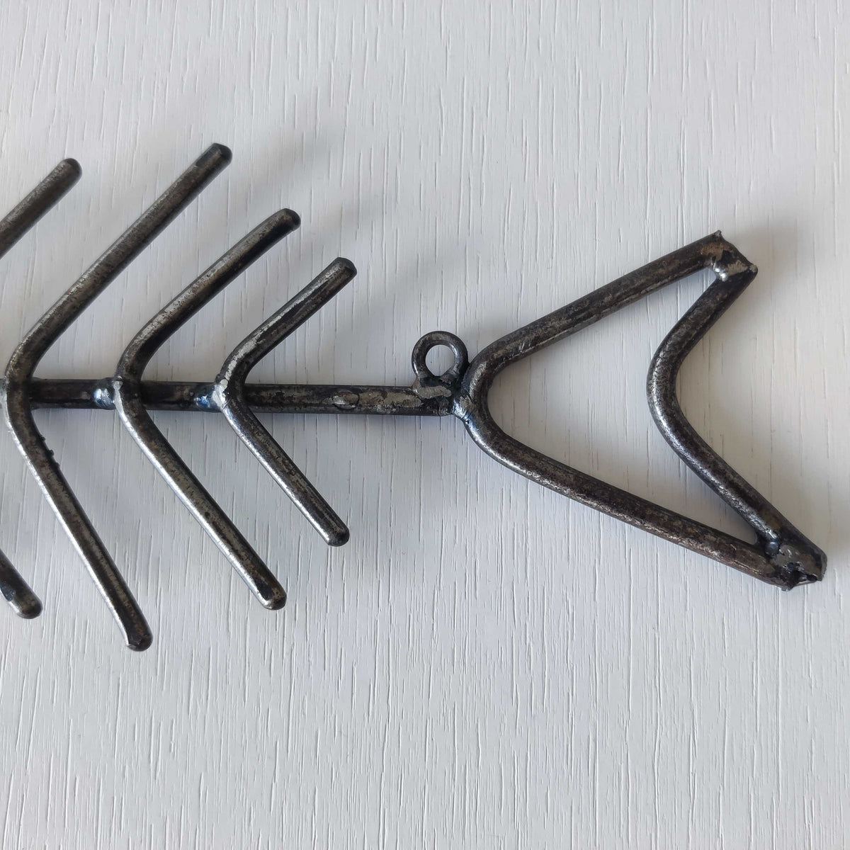 Vintage artisan made metalwork welded steel fish skeleton toilet roll holder