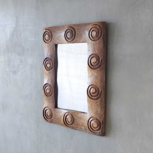 A vintage chunky solid hand carved hardwood wood spiral swirl sculptural mirror