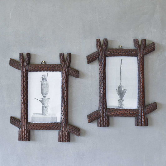 A pair of sculptural tramp folk art notched hand carved oak cross corner frames