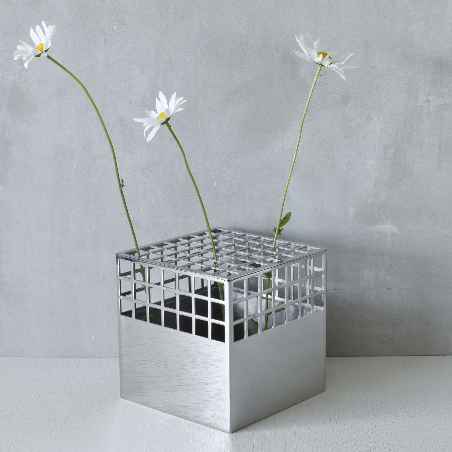 Georg Jensen Matrix stainless steel gridded cube vase designed by Monica Förster