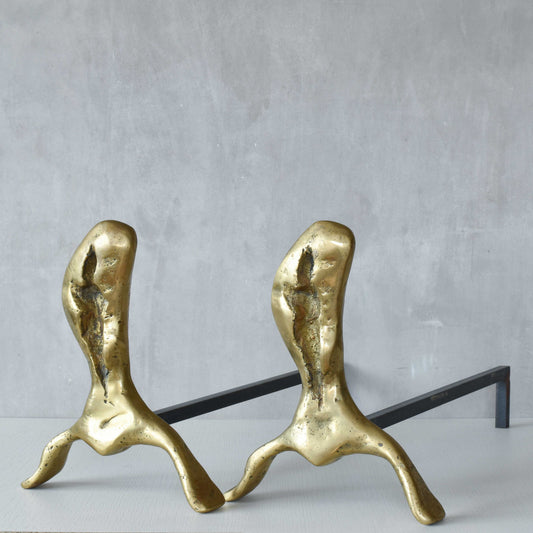 A David Marshall pair of organic brutalist sand cast brass sculptural fire dogs