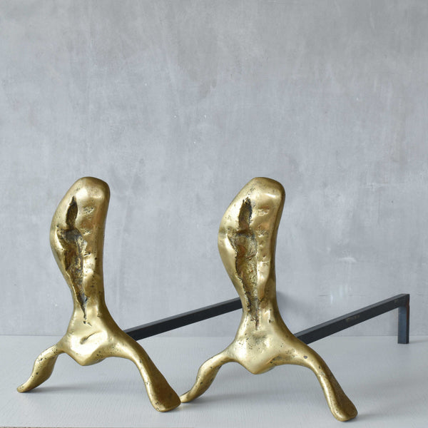 A David Marshall pair of organic brutalist sand cast brass sculptural fire dogs