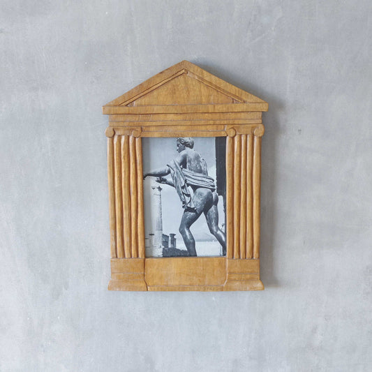 A hand carved hardwood neoclassical style photo frame
