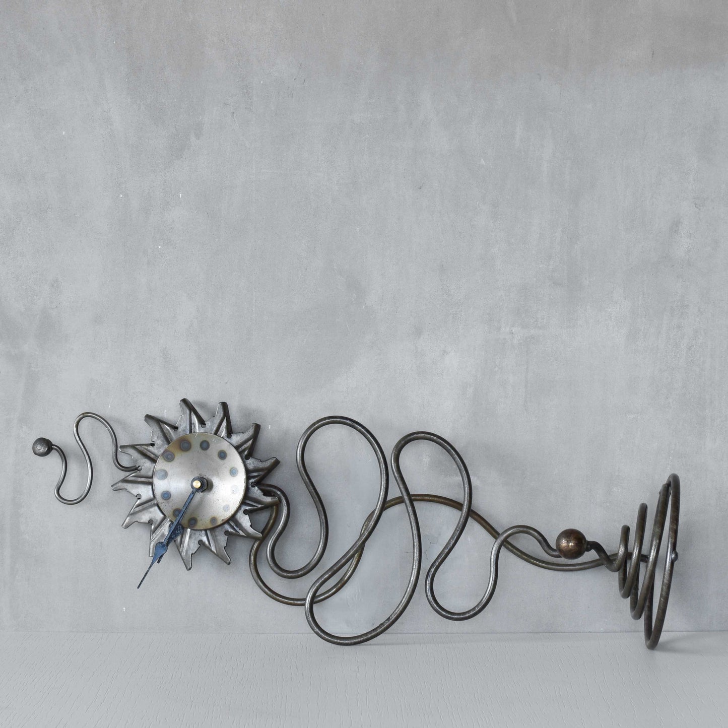 A large vintage blacksmith made forged steel abstract sculptural clock