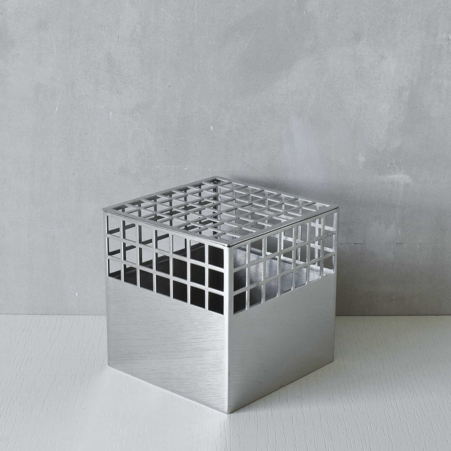 Georg Jensen Matrix stainless steel gridded cube vase designed by Monica Förster
