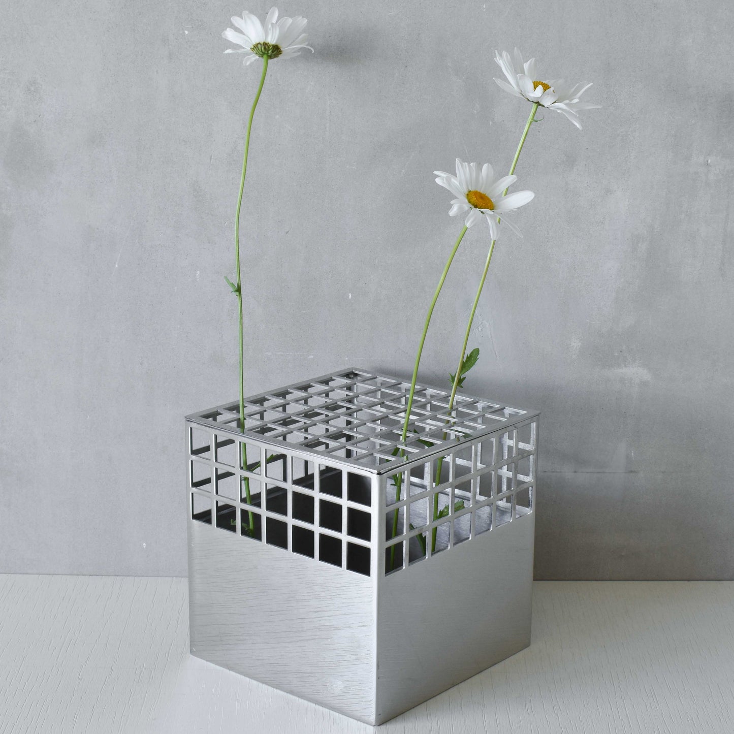 Georg Jensen Matrix stainless steel gridded cube vase designed by Monica Förster
