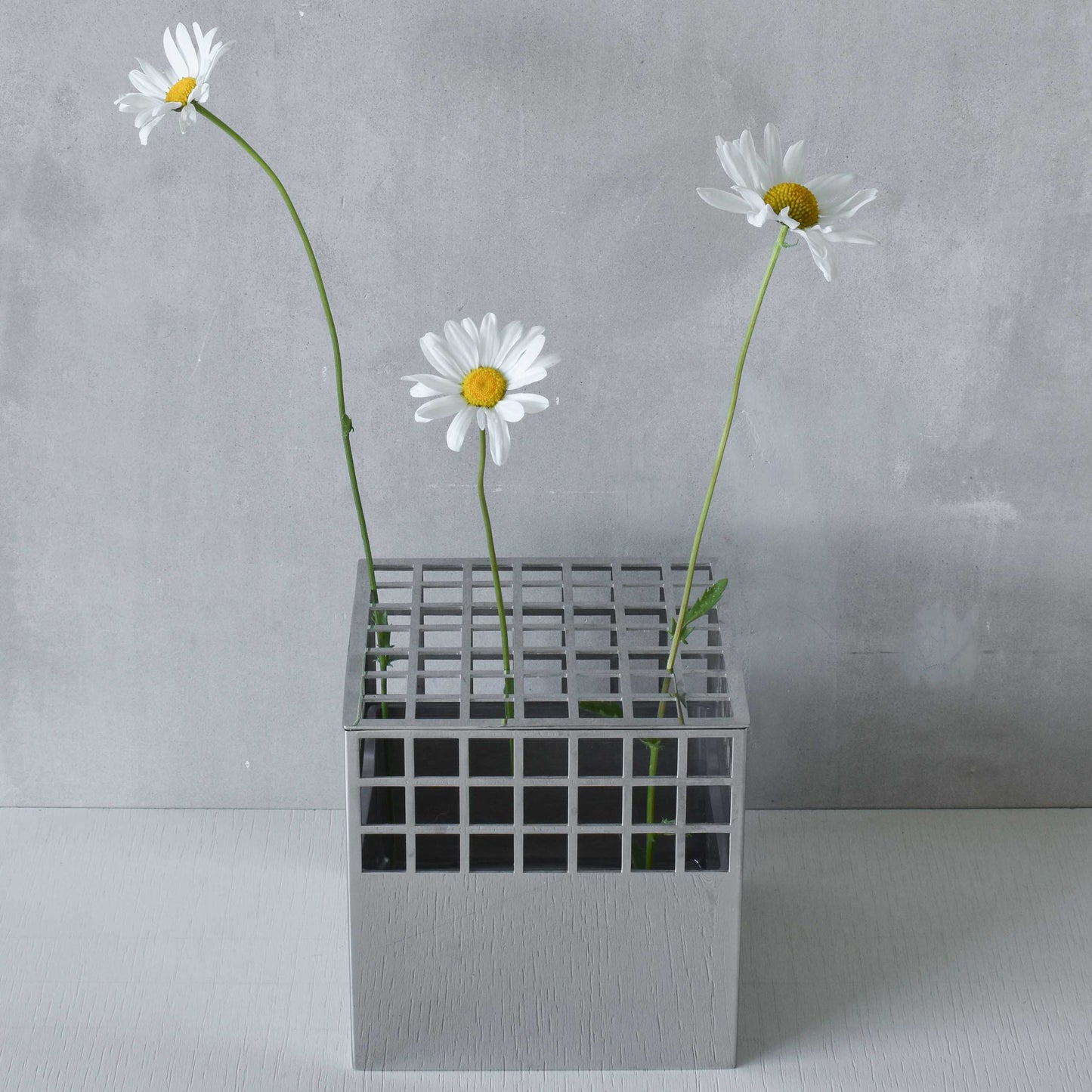 Georg Jensen Matrix stainless steel gridded cube vase designed by Monica Förster