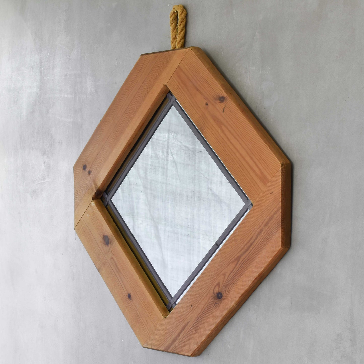 A 1990s pine framed leaded mirror with rope loop