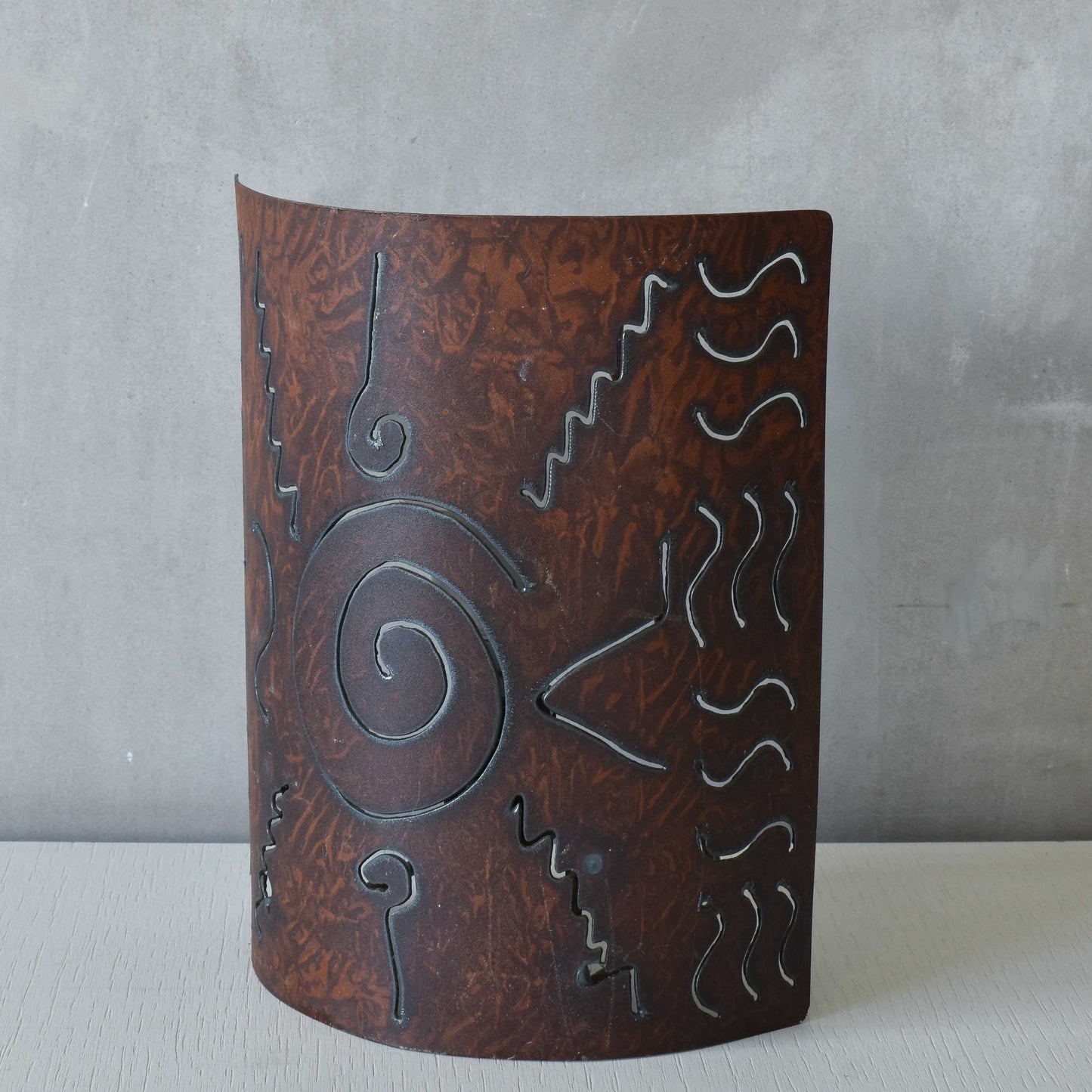 A pair of vintage torch cut steel abstract wall lights sconces