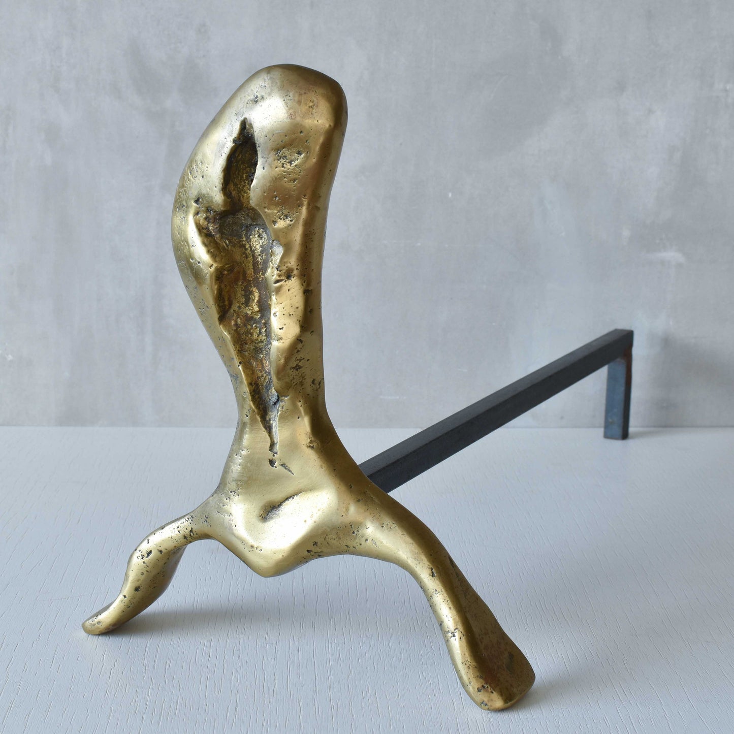 A David Marshall pair of organic brutalist sand cast brass sculptural fire dogs