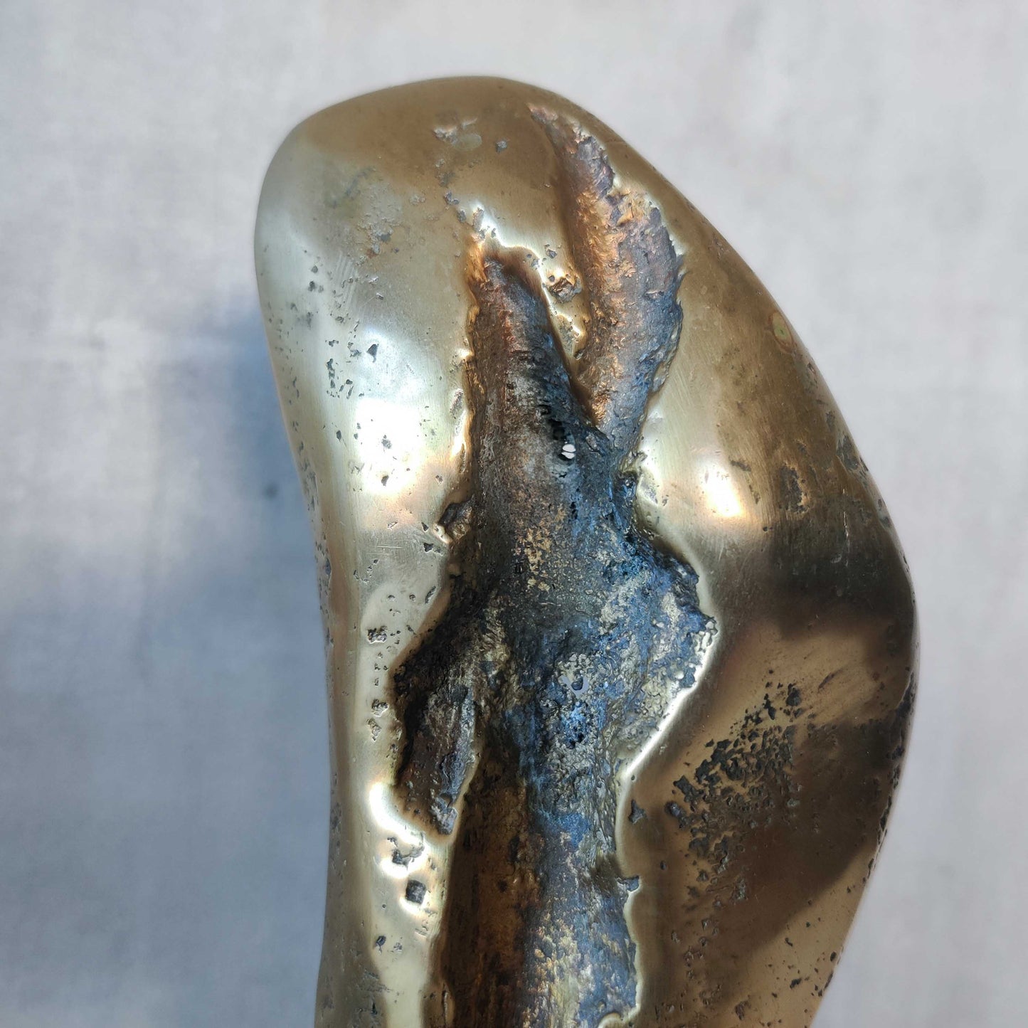 A David Marshall pair of organic brutalist sand cast brass sculptural fire dogs
