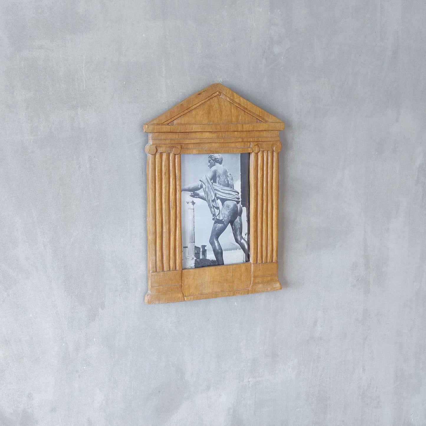 A hand carved hardwood neoclassical style photo frame