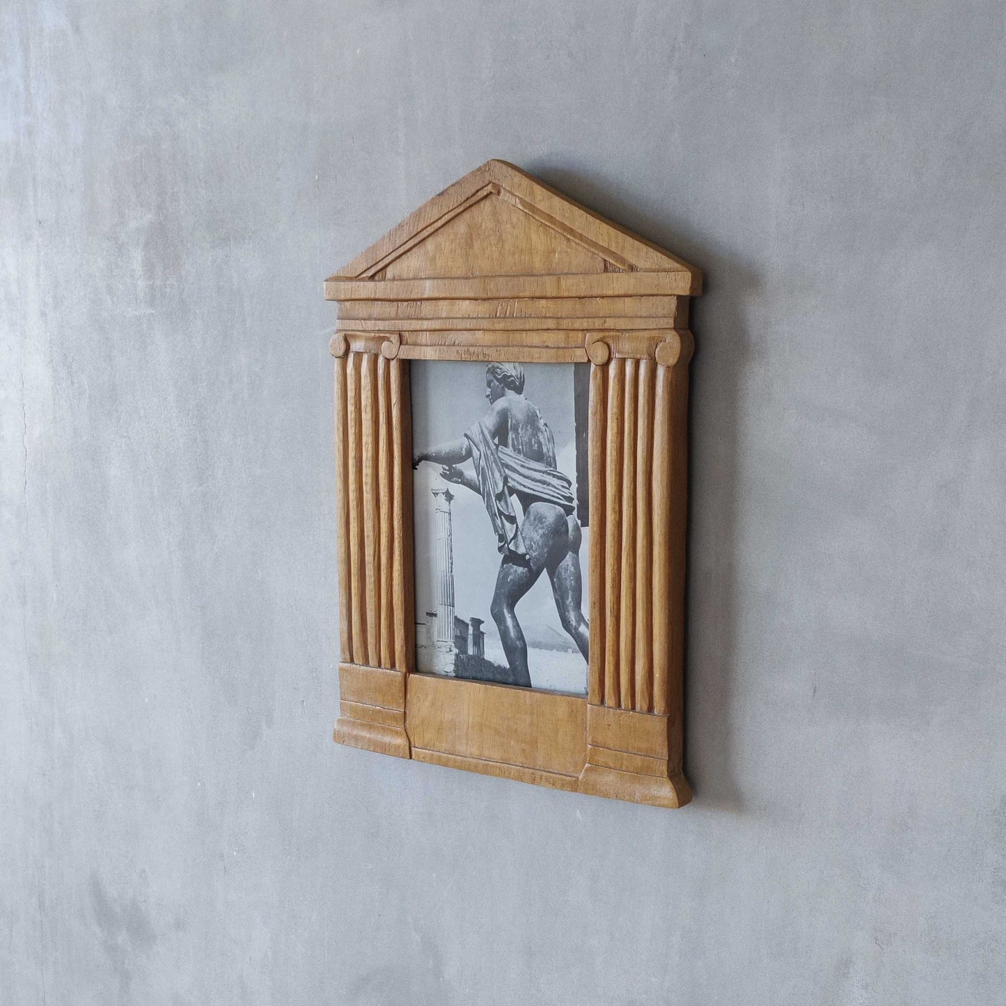 A hand carved hardwood neoclassical style photo frame