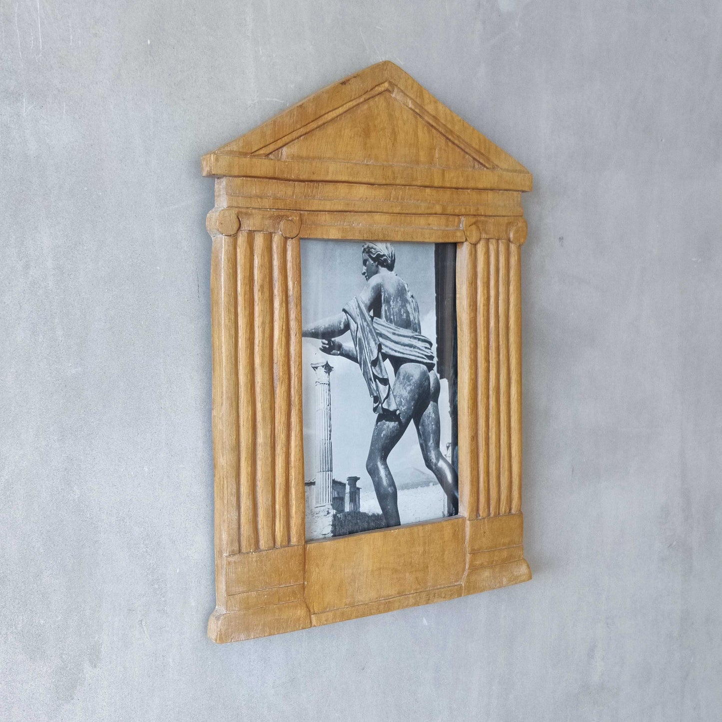 A hand carved hardwood neoclassical style photo frame