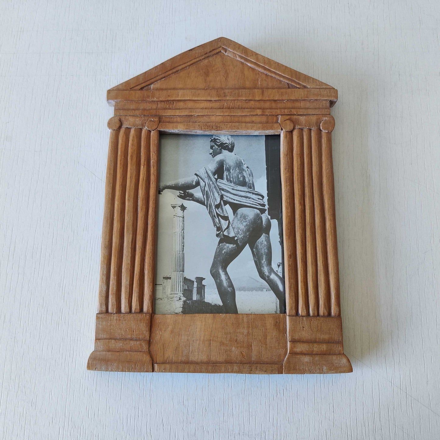 A hand carved hardwood neoclassical style photo frame