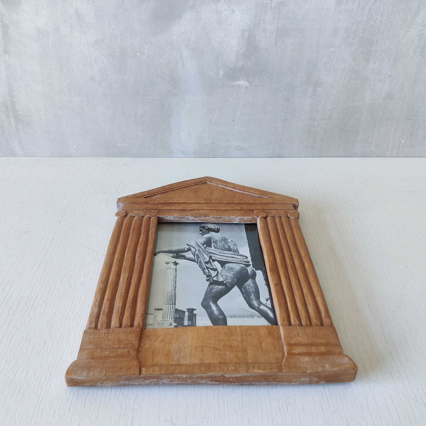A hand carved hardwood neoclassical style photo frame
