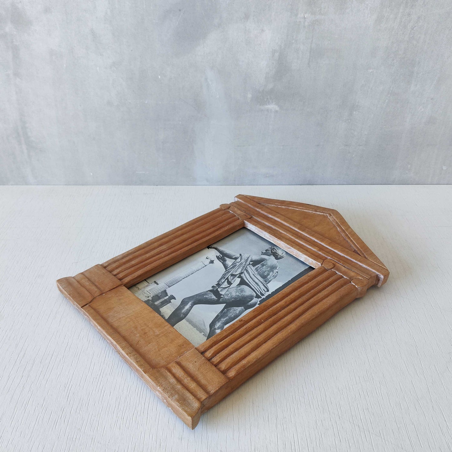 A hand carved hardwood neoclassical style photo frame