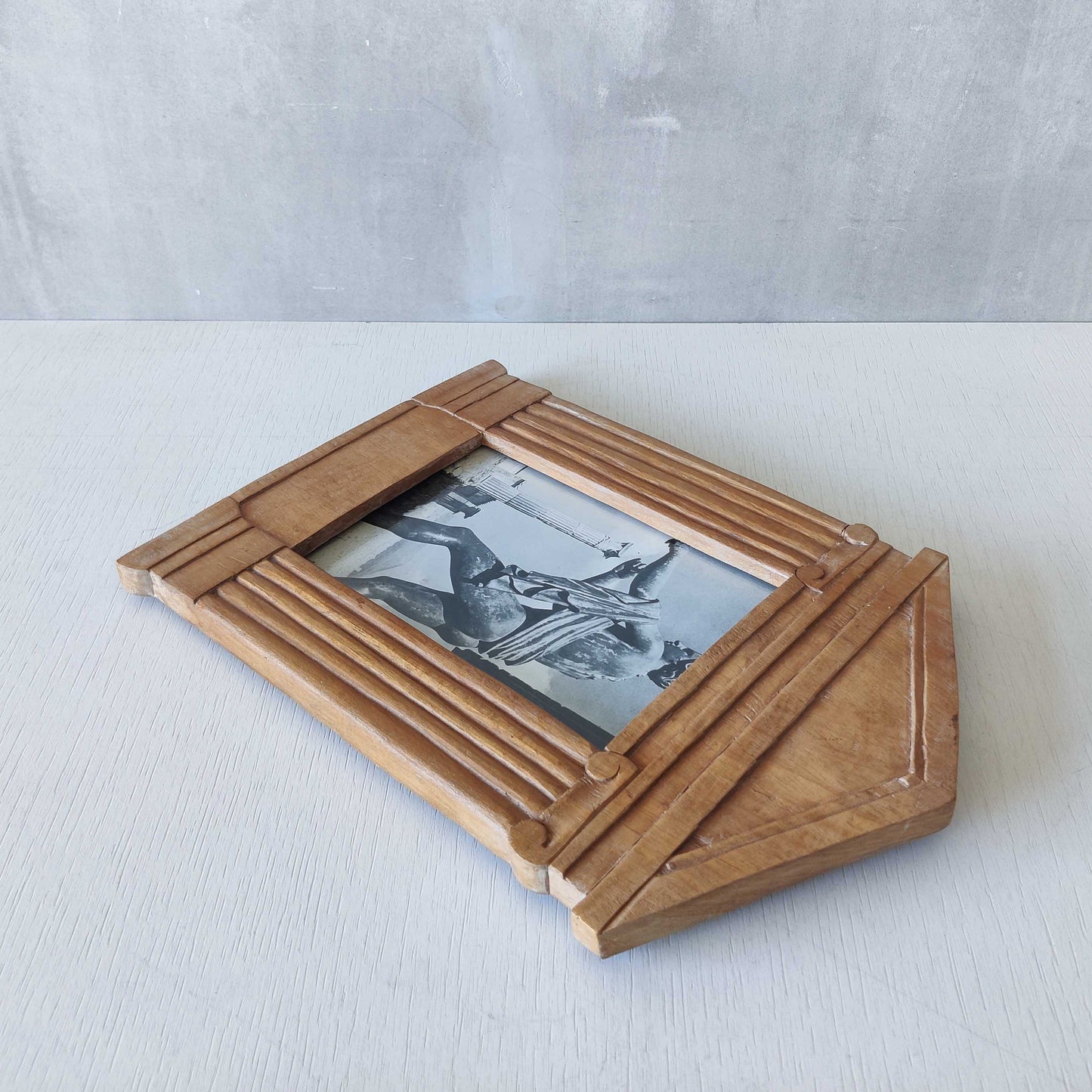 A hand carved hardwood neoclassical style photo frame