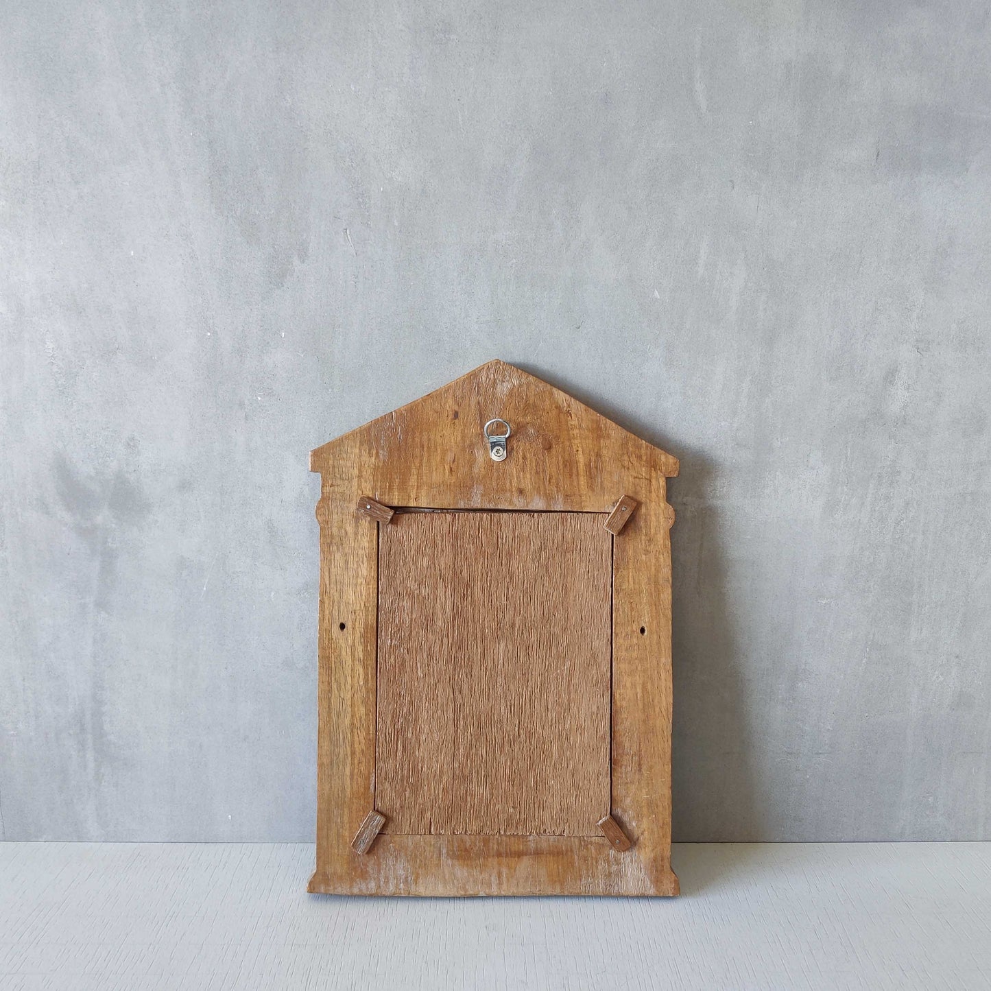 A hand carved hardwood neoclassical style photo frame