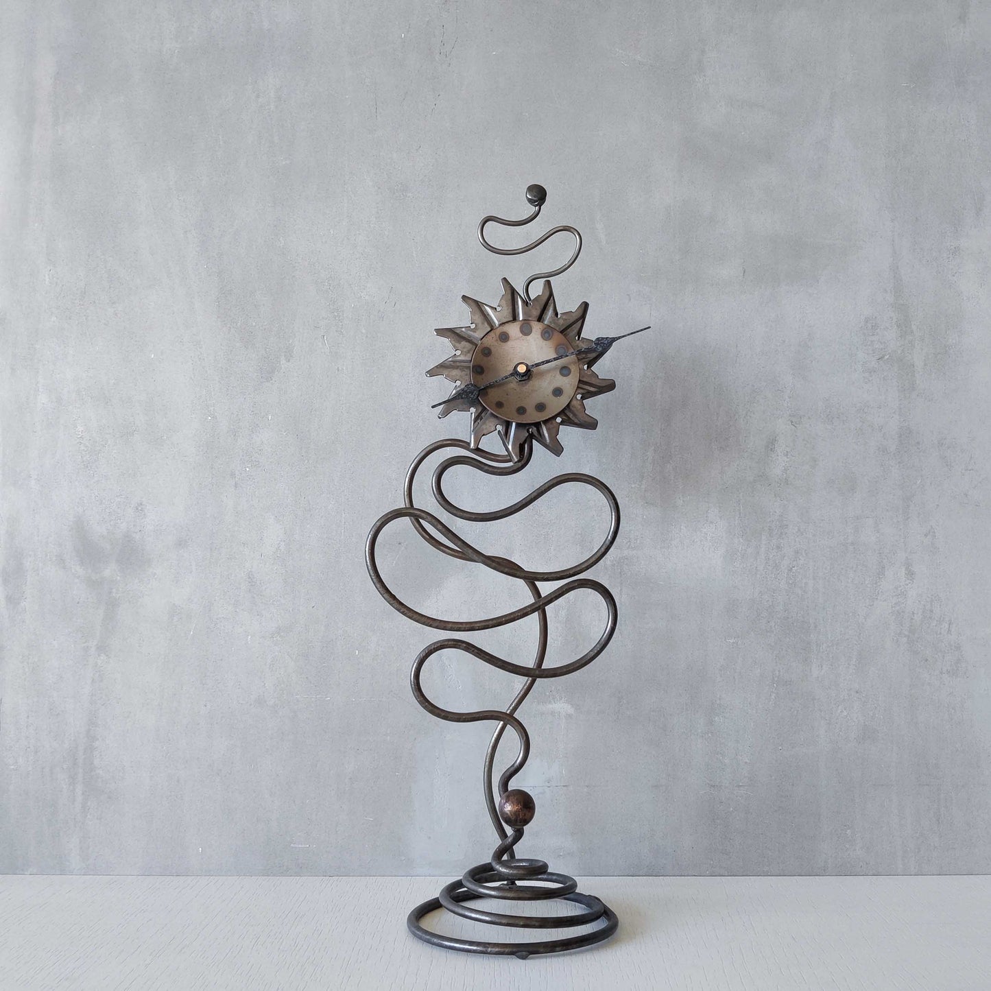 A large vintage blacksmith made forged steel abstract sculptural clock