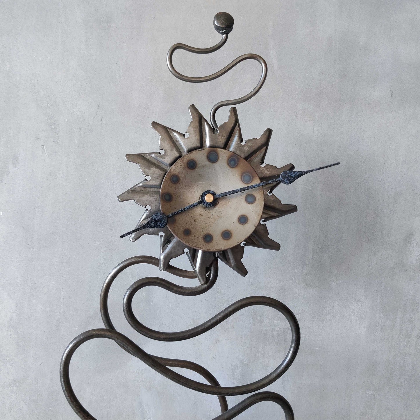 A large vintage blacksmith made forged steel abstract sculptural clock