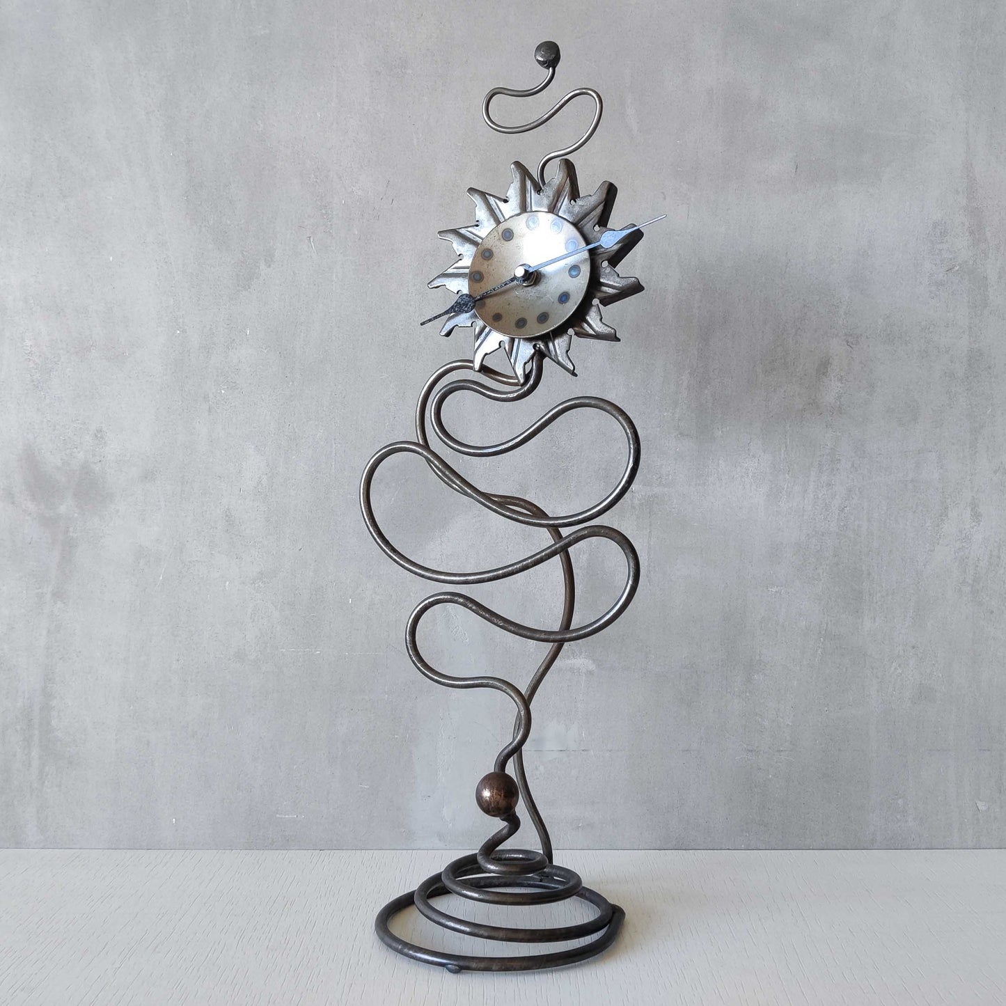A large vintage blacksmith made forged steel abstract sculptural clock