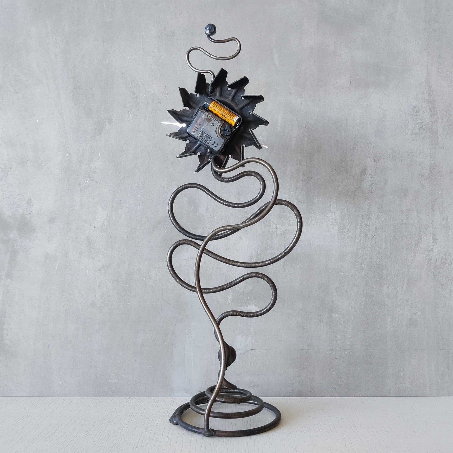 A large vintage blacksmith made forged steel abstract sculptural clock