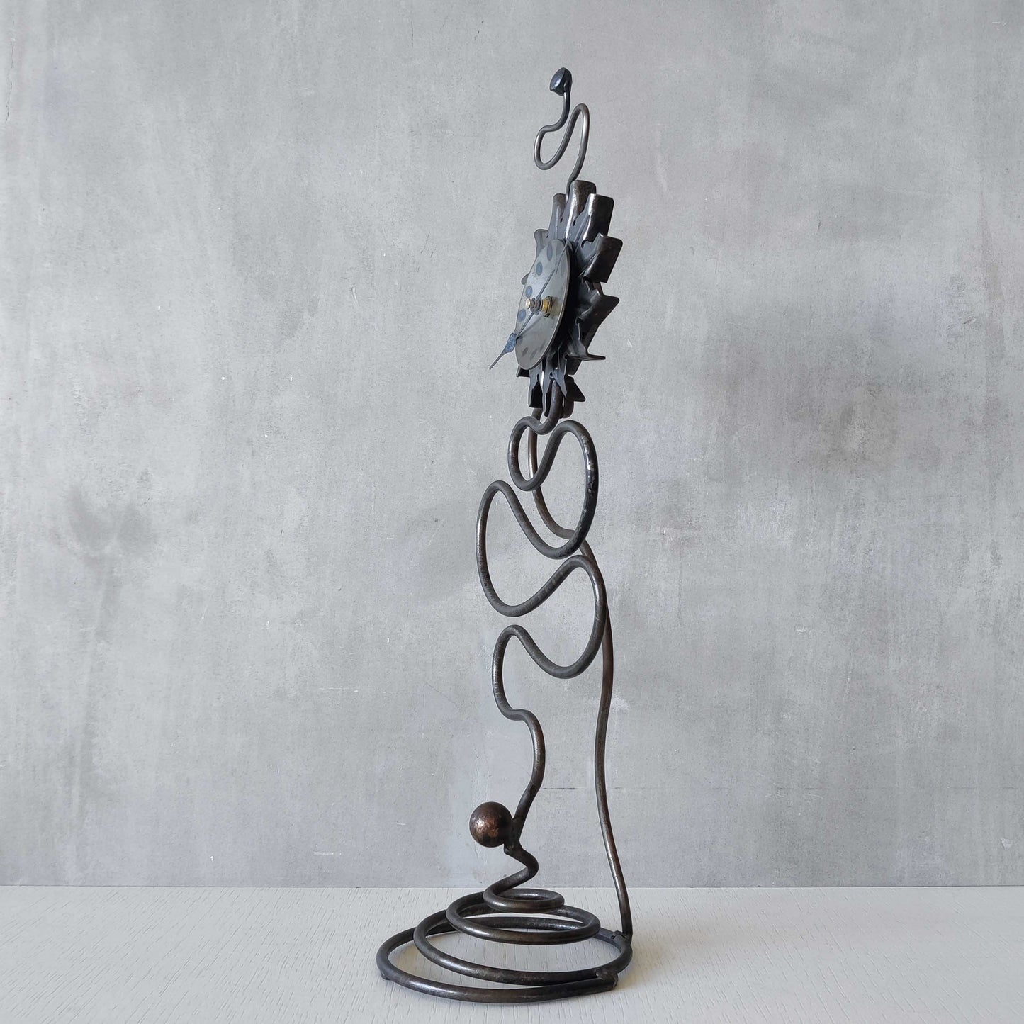 A large vintage blacksmith made forged steel abstract sculptural clock