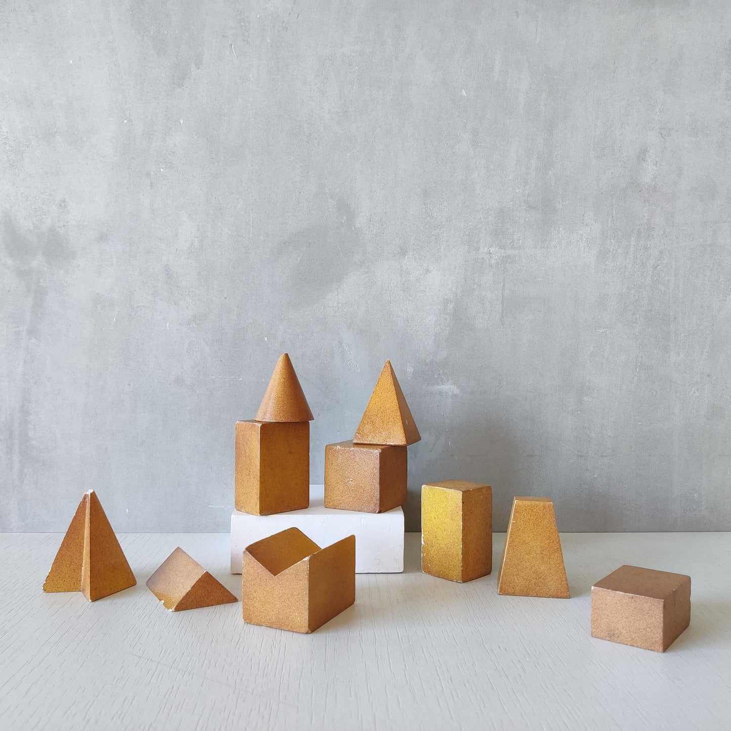 A set of 10 painted cast plaster 1950s geometric solids architectural models