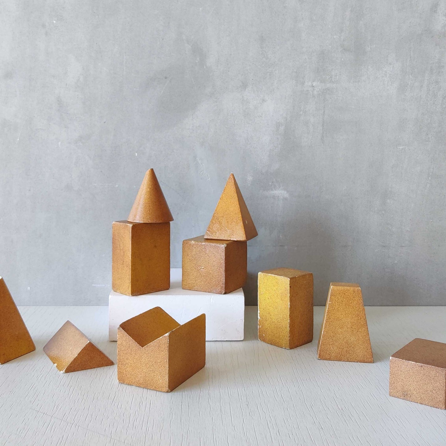 A set of 10 painted cast plaster 1950s geometric solids architectural models
