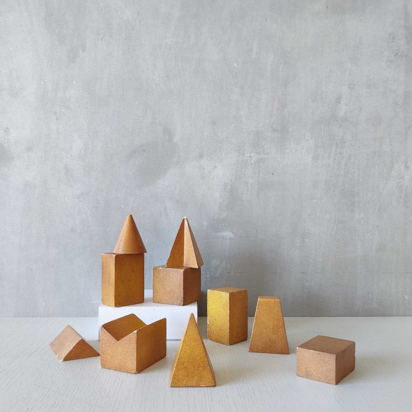 A set of 10 painted cast plaster 1950s geometric solids architectural models