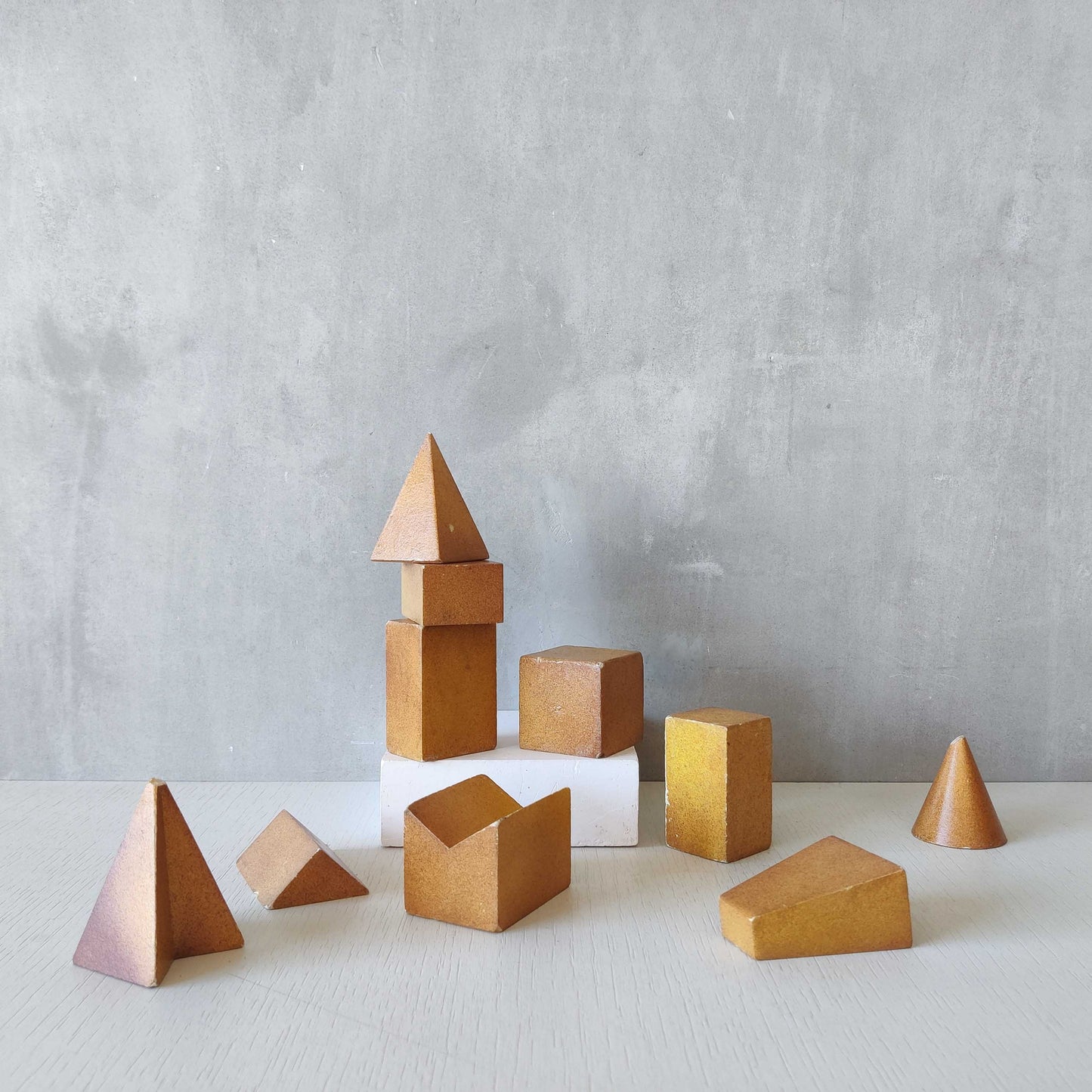 A set of 10 painted cast plaster 1950s geometric solids architectural models