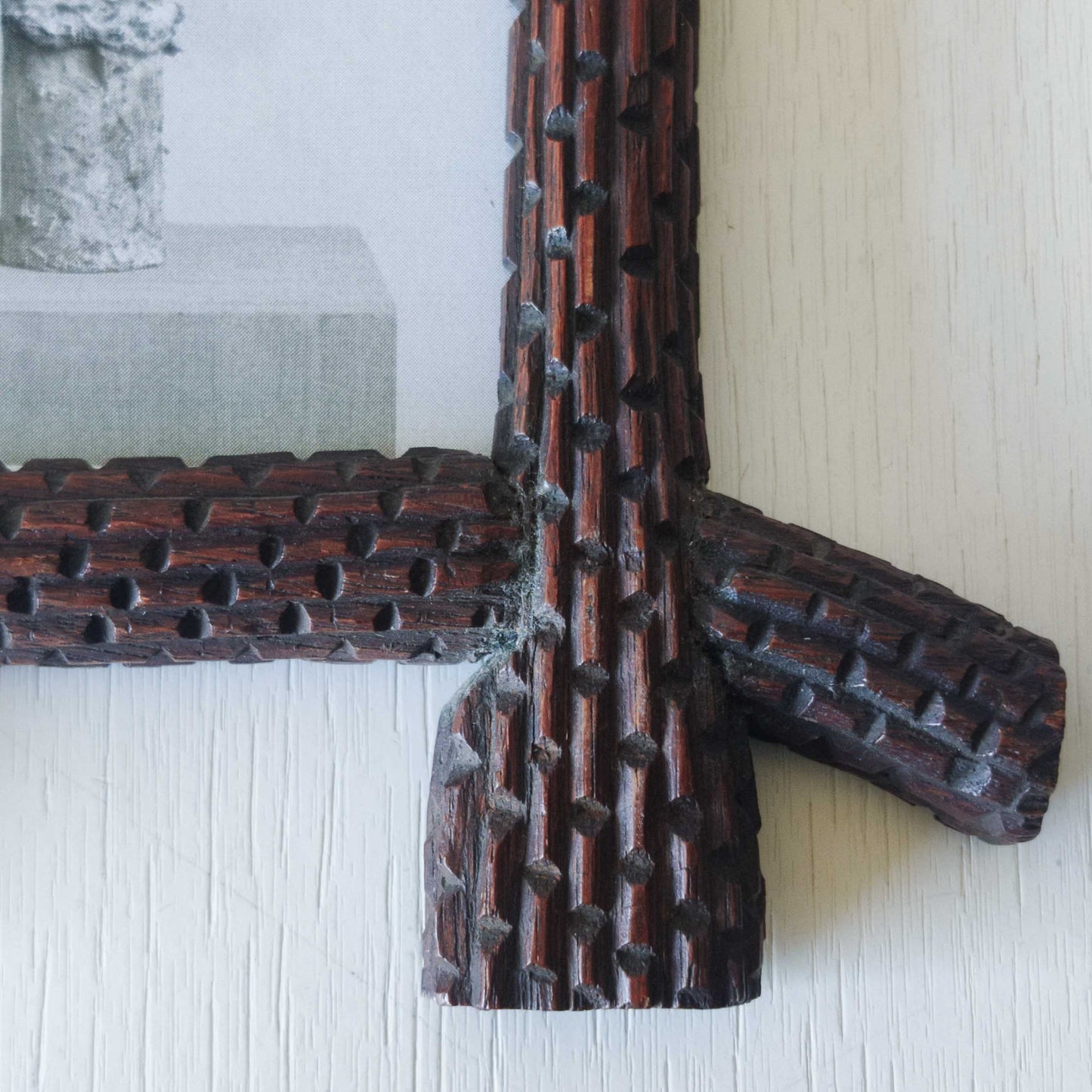 A pair of sculptural tramp folk art notched hand carved oak cross corner frames